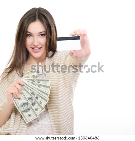 Cheerful attractive young lady holding cash with plastic card and happy smiling over white background