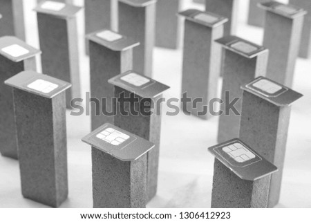 black and white photo SIM cards lying on the bars standing upright