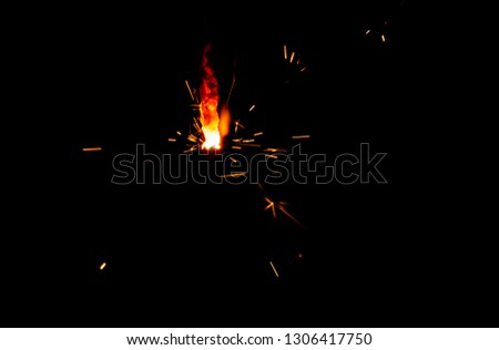 Sparks of fire on a black background. Christmas sparkler . Bengal fire.