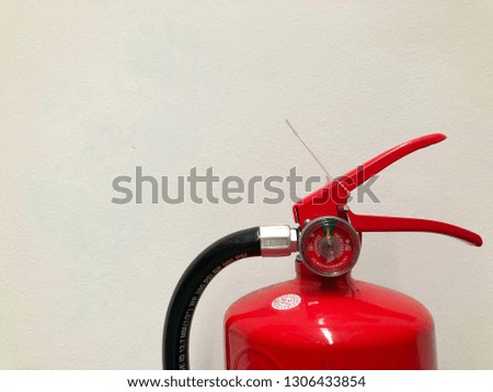 Dry chemical fire extinguishers on the wall Ready for use in case of fire.