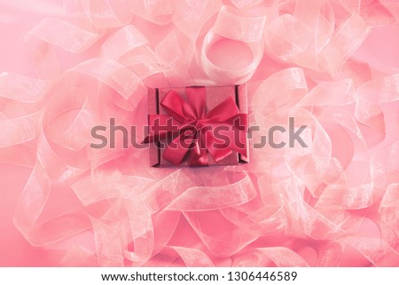 Abstract textured coral background. Ribbon curls top view