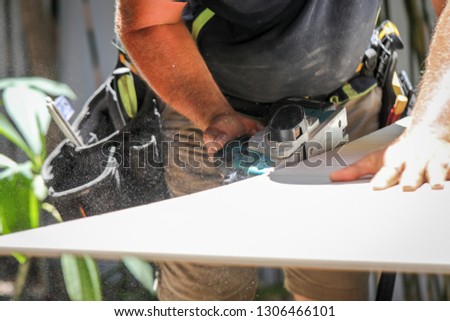 A Carpenter/ tradesman working on a job site with his tools.  Royalty-Free Stock Photo #1306466101