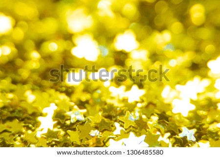 Gold glitter stars texture. Festive sparkling sequins background. Wpaper for