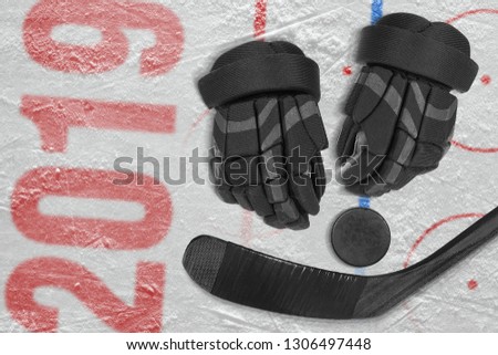 Hockey stick, gloves and puck on the ice. Concept, hockey, season, wallpaper