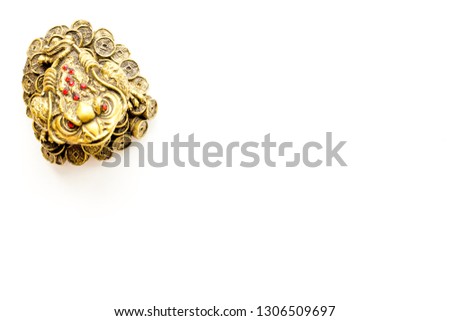 Buddhist symbol. Oriental three legged toad with gold coins on white background top view space for text