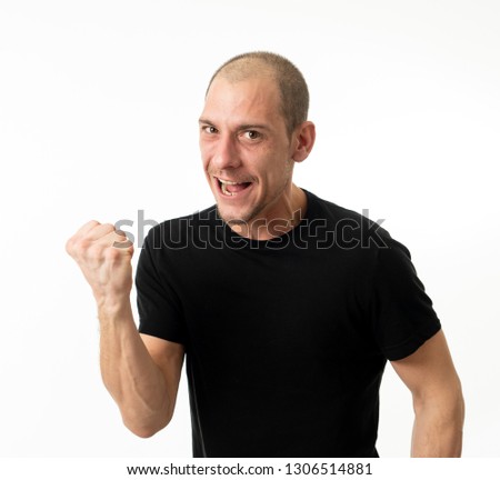 Happy face and facial expressions in people and human emotions. Half length portrait of smiling young adult man excited gesturing and celebrating victory and success isolated on white background.