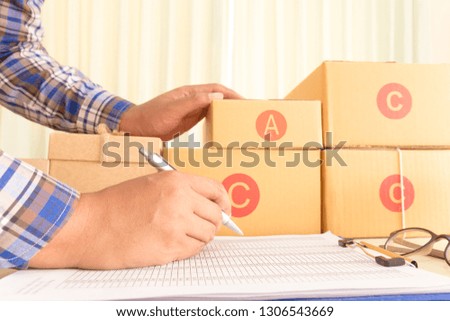 Workplace parcel box delivery home office. laptop notebook on table, using for shopping online, e-commerce and internet banking. startup project SME business concept. free space add text background.