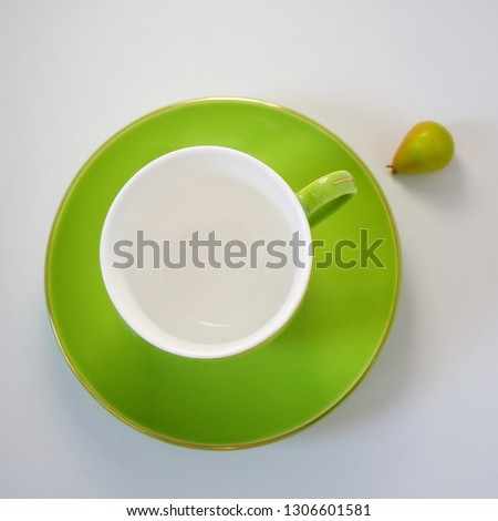 green cup and saucer