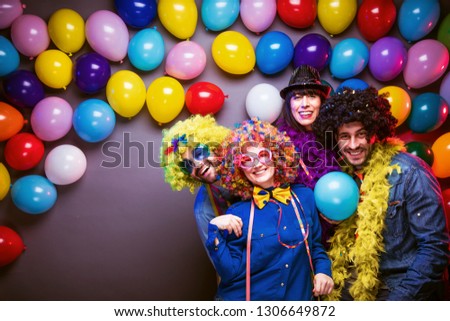 Party people celebrating carnival or new years in Party club