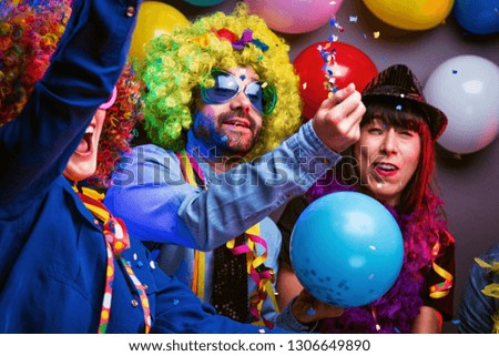 Party people celebrating carnival or new years in Party club