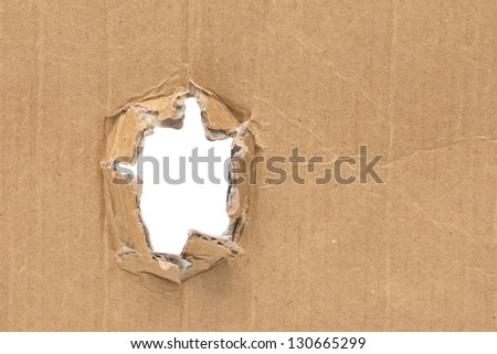 white hole in a cardboard background