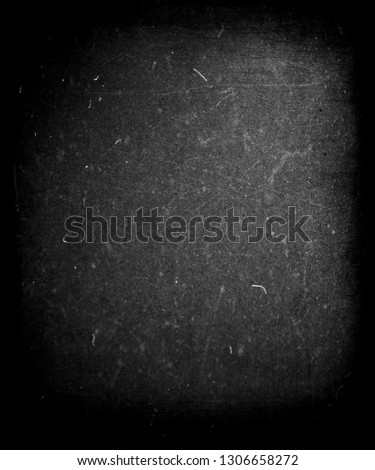 Grunge black scratched background with frame, chalkboard texture