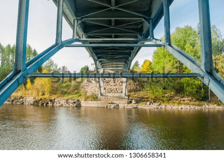Autumn landscape of bridge and Kymijoki river waters in Finland, Kymenlaakso, Kouvola, Myllykoski