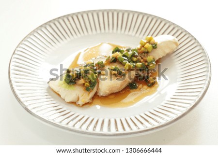 Chinese food, steamed cod fish with ginger and spring onion soy sauce
