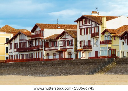 Typical white and red buildings from Saint Jean de Luz, France, Pays Basque. Royalty-Free Stock Photo #130666745