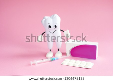 Healthy white tooth. Tooth on pink background. Advertising for dentistry.