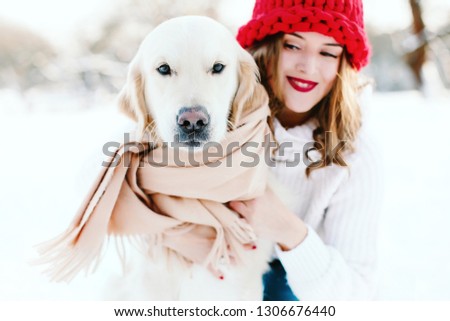 Winter forest. Woman with a dog on a snow.