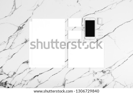 Photo of branding identity mock up on white marble. Template isolated on marble background. For graphic designers presentations and portfolios marble premium luxury mock-up