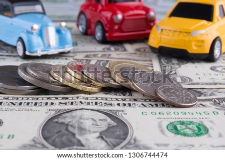 Toy cars and Coins on the One dollar bills