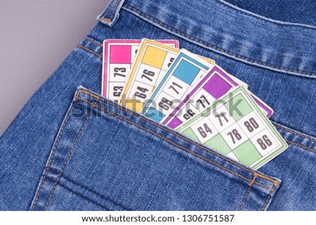 Tombola cards in jeans pocket