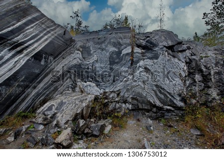 Marble texture of Ruskeala mountain Park. Russia. Karelia. Ruskeala mountain Park is a former marble quarry filled with groundwater. Royalty-Free Stock Photo #1306753012