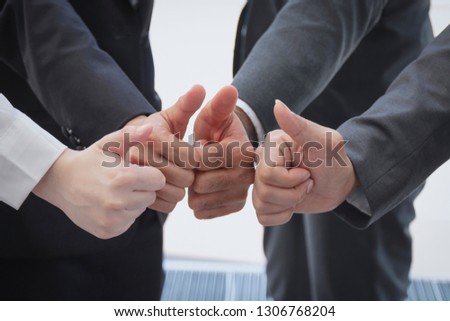 Business team showing thumps up gesture, Like concept