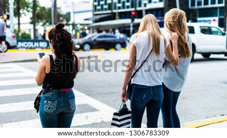 People interacting outdoors in the city, doing different activities and enjoying a cosmopolitan atmosphere on a summer afternoon. Busy city and tourism environment.