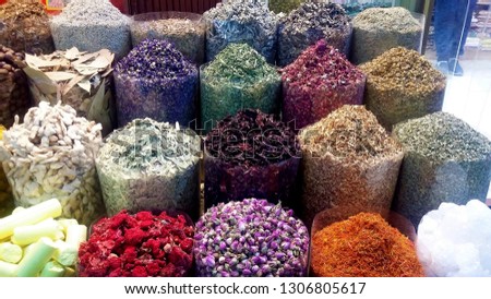 
The picture shows different spices and tea at a street market in Dubai. Large variety and colors.