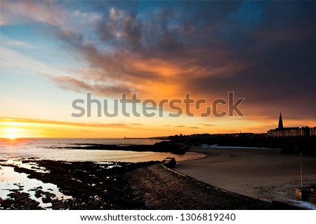 Sunrise on a bitterly cold January morning at Cullercoats Bay, North Tyneside in North East England.