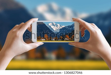 hands take photo of nice mountain and sky scenery view with mobile smartphone