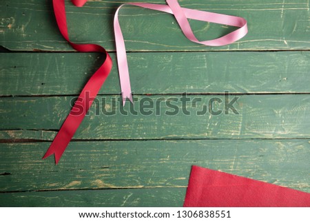 Red and pink ribbons on green wallpaper - Valentine's Day