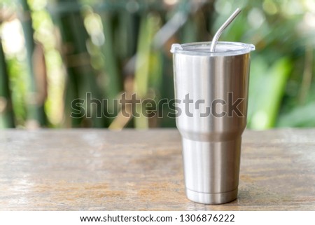 Stainless steel tumbler with stainless straw keeping of the drink cold or hot. Reduce plastic pollution concept.