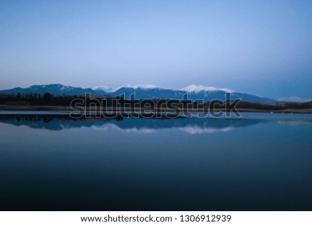 Lake mirroring mountains