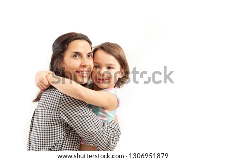 Portrait of happy daughter embraces her mother, isolated on whit
