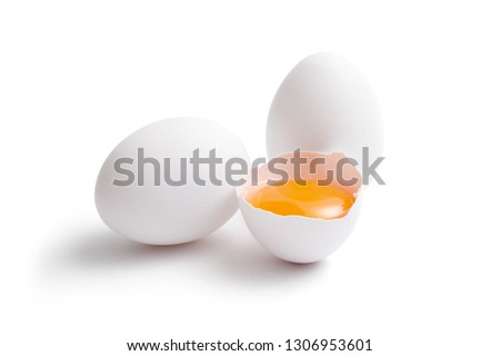 White eggs, whole and broken egg half with a yolk isolated on a white background. Royalty-Free Stock Photo #1306953601