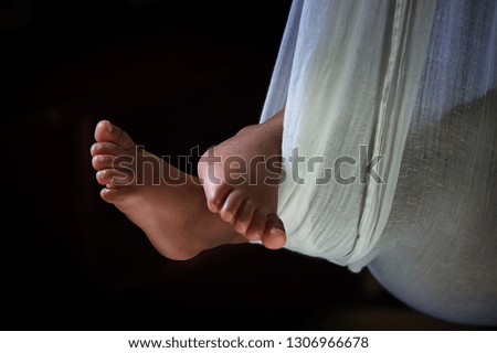 Baby sleeping on bed - natural windows light background.