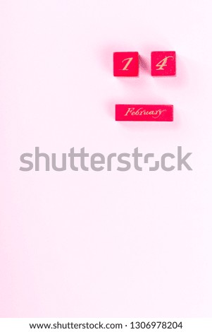 Wooden block calendar  of February 14  on a pink background. Valentines Day, is celebrated every year.Holiday concept.Day of Love.Flat lay, top view, copy space