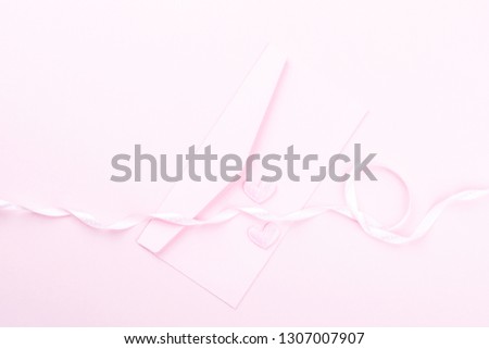 Valentines day composition on pastel pink background. Heart shaped confetti letter.Сoncept of holiday and love. Flat lay, top view, banner, copy space