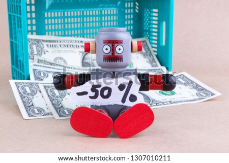 Fifty percent off  word with sitting robot