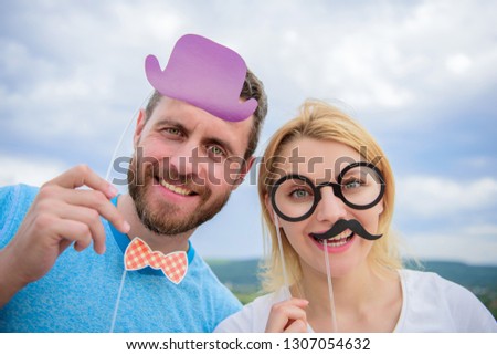 Party or Birthday concept. Young couple in a photo booth party