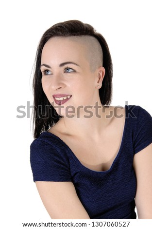 A beautiful young woman in a close up image with short black hair
shaved on one side, looking up, isolated over white background

