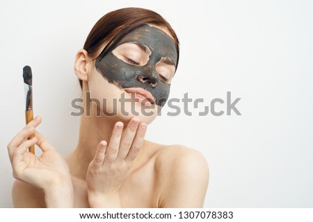 woman in a cosmetic mask