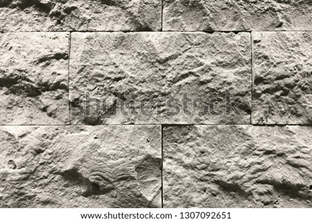 Grey Stone wall with a beautiful pattern texture.