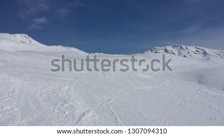 Sunny winter day on ski slopes of Madrisa mountain in Klosters, Switzerland
