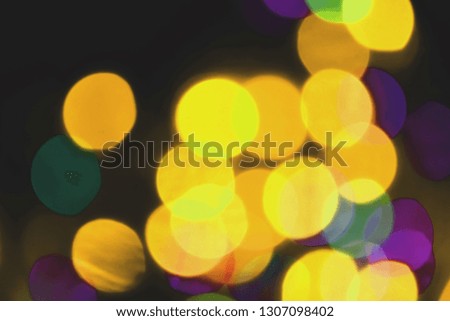Colorful lights bokeh background, Chrismas lights bokeh. Colorful abstract background. Blurred and glowing lights. Boceh lens effect from lighting spots.