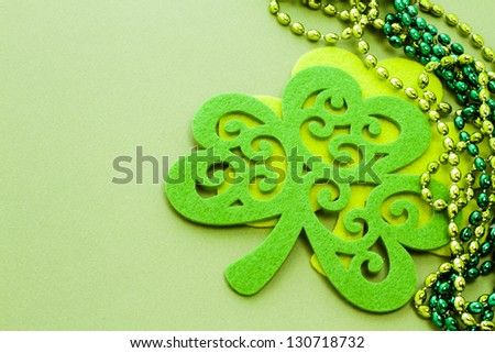 St. Patricks Day doilies on green background.