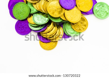 Multi color Mardi Gras tokens on white background.