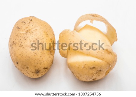 Peeled potato skin Royalty-Free Stock Photo #1307254756