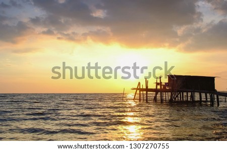Explosive sunset at Pasir Panjang Negeri Sembilan Malaysia featuring  vintage fisherman hut