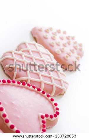 Gourtmet heart shaped cookies decorated for Valentine's Day.
